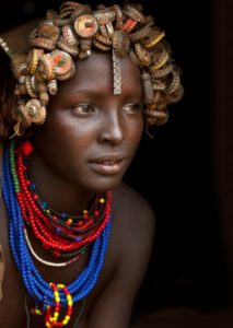 Ethiopia, Omo Valley, Omorate, Portrait Of A Young Dassanech Cute Woman Wearing Bottle Caps Headgear And Beaded Necklaces