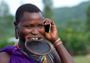 Ethiopia, Omo Valley, Tulgit, Suri Woman With Lip Plate And Mobile Phone