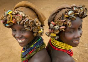 Ethiopia, Omo Valley, Omorate, Two Young Dassanech Girls Wearing Bottle Caps Headgear