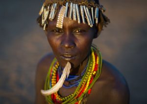 Ethiopia, Omo Valley, Omorate, Dassanech Tribe Woman With A Feather In The Chin